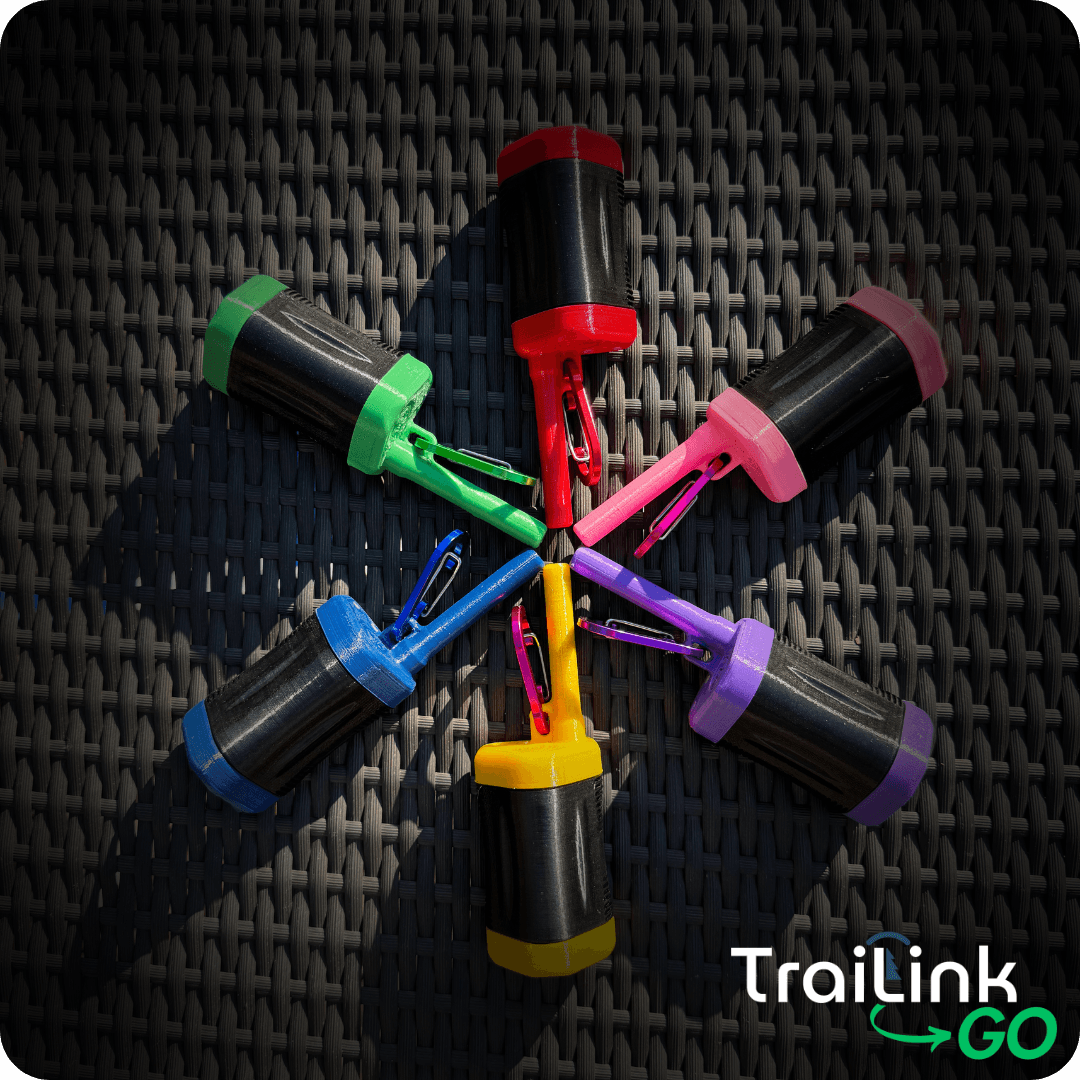Seven TraiLink Go devices in different shell colours arranged in a star
